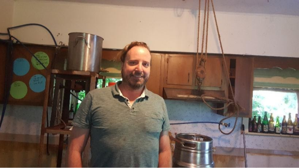 John Compton with homebrew equipment.